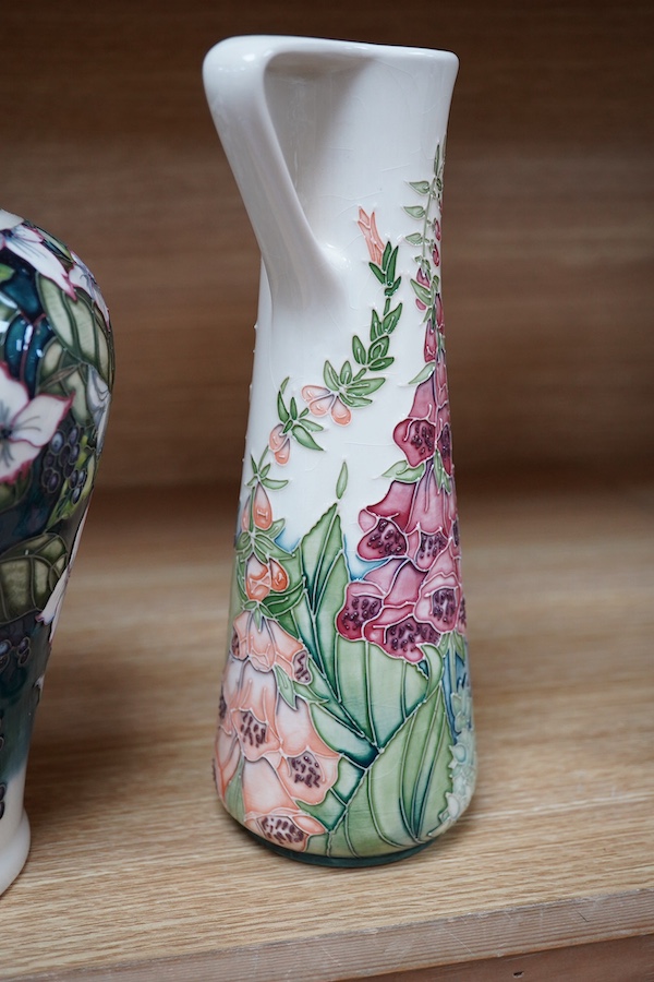 A Moorcroft ‘Nostalgia’ pattern vase together with a similar ‘Foxglove’ pattern ewer, 24.5cm. Condition - good, some crazing